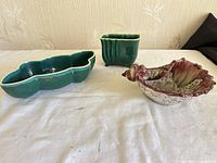 Three ceramic pieces grouped together