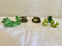 Six frog figurines displayed together