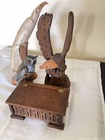 All three bird sculptures and chest grouped