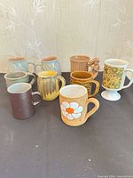 Group shot of all nine mugs front view