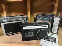Three portable radios displayed together