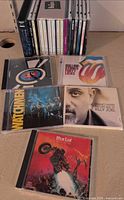 Overall view of all CDs: vertical stack plus five key album covers displayed