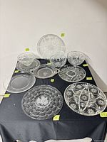 Group shot of seven platters and three bowls on table