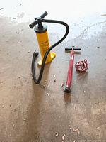 Overall view of two pumps and coiled cable on floor