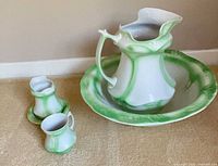 Full set showing large pitcher, basin, small pitcher, mug