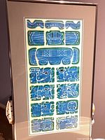 Entire framed artwork showing glyph panels and frame
