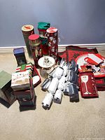 Overview of entire lot showing gift boxes, crackers, trays, placemats