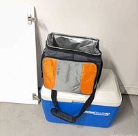 Coleman hard cooler with Escort soft cooler placed on top