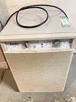 Front view of Danby dehumidifier with control panel and cord