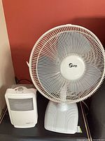 Front view of Super fan and Uberhaus heater side by side