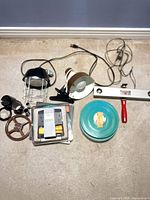 Group shot showing all items laid out: lighting units, splicer, reels, lenses