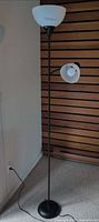 Full view of floor lamp unlit showing both shades and cord
