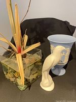 Wedgwood blue Jasperware vase, white ceramic bird figurine, artificial orchid in glass vase
