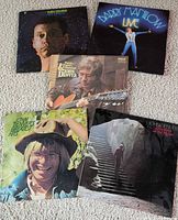 Group shot of all five LP album covers