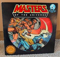 Front sleeve displaying Masters of the Universe picture disc inside