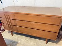 Angled view of full dresser showing overall form and surface