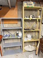 Grey and yellow-cream metal shelving units side by side