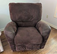 Front view of chocolate-brown recliner, footrest closed