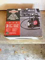 Retail box front showing Motomaster programmable direct drive air compressor