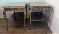 Both matching walnut side tables front view