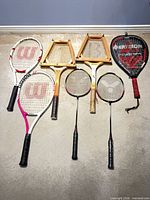 All seven racquets laid out on floor