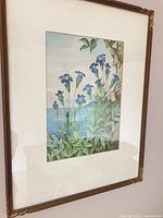 Full view of framed painting showing artwork, mat and frame