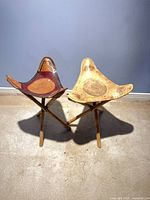 Both stools assembled showing leather seats and bamboo legs