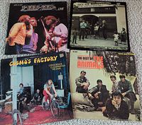 Front covers of all four LPs displayed