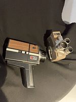 Side view of both movie cameras showing overall designs