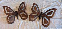 Both wooden butterflies side by side showing overall design and size