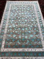 Full view of rectangular turquoise floral Kashan rug