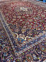 Oblique view showing red field, blue border and overall pile quality