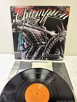 Front jacket of Champion LP with record partially shown