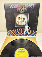 Front cover artwork featuring Sesame Street Fever title and characters