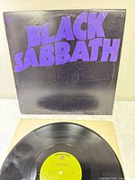 Front sleeve showing embossed artwork and record partially visible