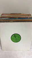 Stack of approximately 40 LPs with plastic wrap