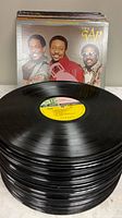 Stack of vinyl records with The Gap Band IV cover visible