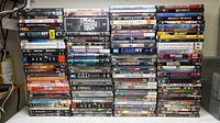 Front view of five stacks of DVDs showing variety of movie and TV titles