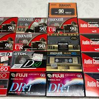 Overall layout showing 15 sealed tapes of various brands