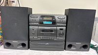 Front view of Magnavox FW34 main unit with speakers attached