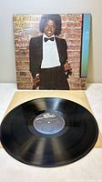 Front jacket and record showing artist in tuxedo