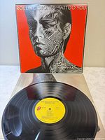 Front cover with record partially visible