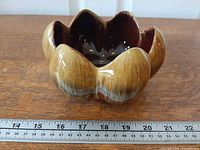 Side view showing lotus shape and glaze