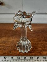 Full view of clear glass lovebirds figurine showing design and base