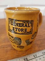 Front view showing "General Store" label and illustrated barrel, sugar bags, etc.