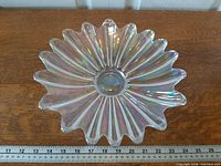 Top view showing full bowl, iridescent finish, ruler indicates roughly 11-inch diameter
