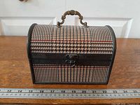 Front view showing houndstooth pattern, latch, handle and width measurement
