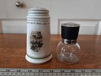 Front view of Himark cheese shaker and Starfrit grinder beside ruler