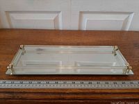 Top view showing entire rectangular mirrored tray and ruler for scale