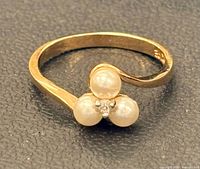 Top view showing tri-pearl cluster and clear stone on gold filled band